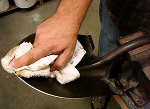 Oiling down the shovel blade
