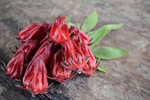 Roselle flower hips resemble deep red dried strawberries without the seeds