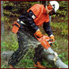 Man using chain saw safely